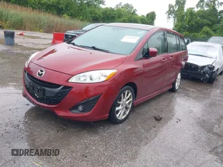 2012 Mazda 5 Grand Touring with VIN JM1CW2DL8C0142628, listed as a IAAI auction lot 42350676 with 84,764 mi miles and . Bid and sale history available at DreamBid. Image 2.