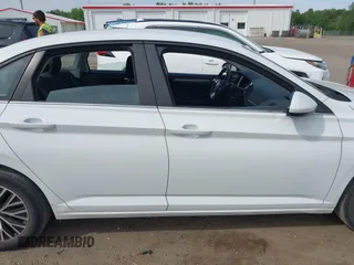 2021 Volkswagen Jetta S z VIN 3VWC57BU0MM021874, wystawiony jako IAAI lot #42124747 z przebiegiem 89 887 mil mil oraz . Historia ofert i sprzedaży dostępna na DreamBid. Obrazek 13.