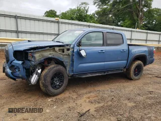 2018 Toyota Tacoma SR z VIN 5TFCZ5ANXJX165279, wystawiony jako Copart lot #56836955 z przebiegiem 250 819 mil mil oraz Szkoda całkowita • Salvage title. Historia ofert i sprzedaży dostępna na DreamBid. Obrazek 1.