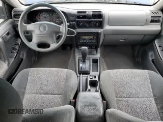 2002 Isuzu Rodeo S with VIN 4S2CK58W124301647, listed as a Copart auction lot 56973895 with 129,009 mi miles and Salvage title. Bid and sale history available at DreamBid. Image 8.