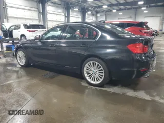 2015 BMW 3 Series 328i xDrive with VIN WBA3B3C50FJ984086, listed as a Copart auction lot 52006475 with 147,065 mi miles and Salvage Title. Bid and sale history available at carsss.com. Image 2.