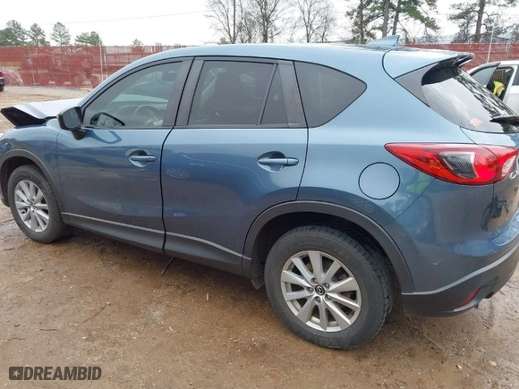 2016 Mazda CX-5 Touring with VIN JM3KE2CY0G0863387, listed as a IAAI auction lot 41612475 with NaN miles. Bid and sale history available at carsss.com. Image 3.