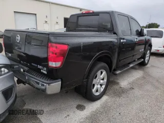 2010 Nissan Titan LE with VIN 1N6BA0EC8AN318538, listed as a Copart auction lot 74122194 with Not Provided miles and Salvage Title. Bid and sale history available at carsss.com. Image 3.