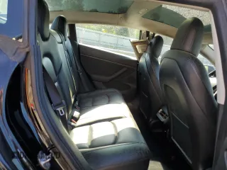 2022 Tesla Model 3 with VIN 5YJ3E1EAXNF286180, listed as a Copart auction lot 52299105 with 129,824 mi miles and Clean Title. Bid and sale history available at carsss.com. Image 10.