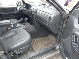 2002 Jeep Grand Cherokee with VIN 1J4GW38N62C190851, listed as a IAAI auction lot 42519384 with 142,066 mi miles and . Bid and sale history available at DreamBid. Image 5.