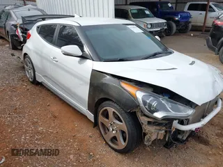 2013 Hyundai Veloster Turbo z VIN KMHTC6AE2DU128607, wystawiony jako IAAI lot #41788836 z przebiegiem 115 500 mil mil oraz . Historia ofert i sprzedaży dostępna na DreamBid. Obrazek 1.
