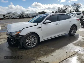 2018 Kia Optima SX with VIN 5XXGV4L21JG201815, listed as a Copart auction lot 45046415 with 99,232 mi miles and Salvage title. Bid and sale history available at DreamBid. Image 1.