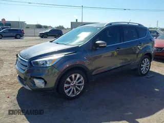 2018 Ford Escape Titanium with VIN 1FMCU0J99JUB09562, listed as a IAAI auction lot 41547659 with 63,700 mi miles and . Bid and sale history available at DreamBid. Image 2.
