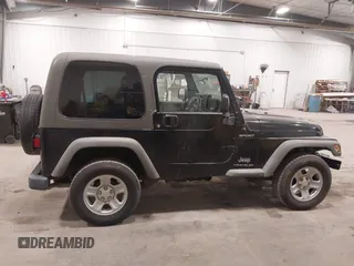 2006 Jeep Wrangler Sport Right Hand Drive with VIN 1J4F449S56P741328, listed as a IAAI auction lot 41476847 with 67,203 mi miles. Bid and sale history available at carsss.com. Image 13.