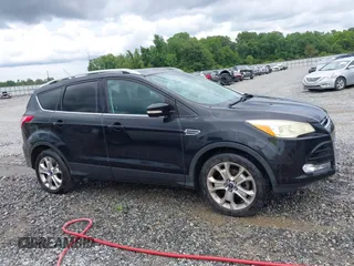 2015 Ford Escape Titanium с VIN 1FMCU0JXXFUB10676, выставлен на аукционе IAAI как лот 42412073 с пробегом 129 737 миль миль и . История ставок и продаж доступна на DreamBid. Изображение 13.