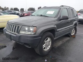 2004 Jeep Grand Cherokee Laredo with VIN 1J4GX48S14C177923, listed as a IAAI auction lot 41745772 with 242,506 mi miles. Bid and sale history available at carsss.com. Image 2.