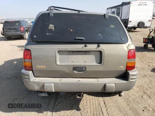 1998 Jeep Grand Cherokee Limited with VIN 1J4GZ78Y2WC146974, listed as a Copart auction lot 71435484 with 192,996 mi miles and Salvage Title. Bid and sale history available at carsss.com. Image 6.