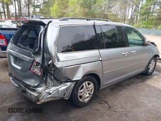 2006 Honda Odyssey EX with VIN 5FNRL38406B066176, listed as a IAAI auction lot 42028052 with 136,305 mi miles and . Bid and sale history available at DreamBid. Image 4.