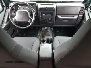 1999 Jeep Wrangler Sport z VIN 1J4FY19SXXP427968, wystawiony jako Copart lot #50102855 z przebiegiem 174 381 mil mil oraz Czysty tytuł • Clean title. Historia ofert i sprzedaży dostępna na DreamBid. Obrazek 8.