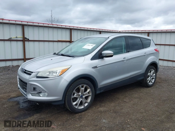 2013 Ford Escape SEL with VIN 1FMCU9H93DUD70670, listed as a IAAI auction lot 41867784 with 207,956 mi miles. Bid and sale history available at carsss.com. Image 2.