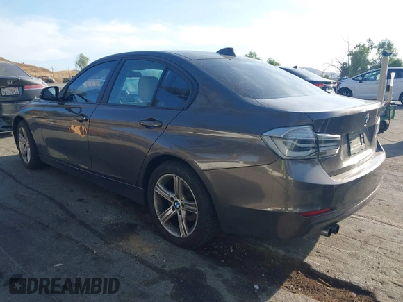 2013 BMW 3 Series 328i with VIN WBA3A5C52DJ462202, listed as a IAAI auction lot 41198588 with 145,010 mi miles. Bid and sale history available at carsss.com. Image 3.