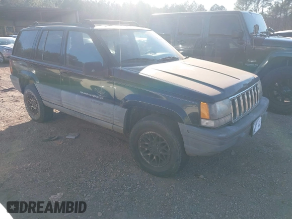 1998 Jeep Grand Cherokee Laredo with VIN 1J4FX58S7WC283734, listed as a IAAI auction lot 41267813 with 266,189 mi miles. Bid and sale history available at carsss.com. Image 1.