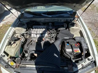 2000 Mitsubishi Diamante LS with VIN 6MMAP67P4YT001142, listed as a Copart auction lot 49667135 with 243,861 mi miles and Clean Title. Bid and sale history available at carsss.com. Image 7.