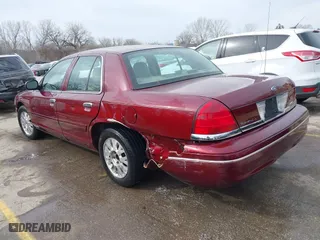 2005 Ford Crown Victoria LX with VIN 2FAFP74W25X106106, listed as a IAAI auction lot 41825793 with 175,740 mi miles. Bid and sale history available at carsss.com. Image 3.