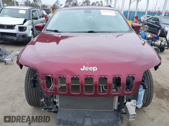 2019 Jeep Cherokee Latitude z VIN 1C4PJMCB7KD442625, wystawiony jako IAAI lot #41872030 z przebiegiem 166 352 mil mil oraz . Historia ofert i sprzedaży dostępna na DreamBid. Obrazek 13.