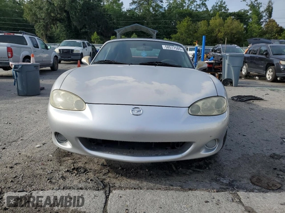 2003 Mazda MX-5 Miata Cloth z VIN JM1NB353630305964, wystawiony jako Copart lot #58517505 z przebiegiem 129 675 mil mil oraz Szkoda całkowita • Salvage title. Historia ofert i sprzedaży dostępna na DreamBid. Obrazek 5.