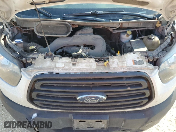 2019 Ford Transit z VIN 1FTYE9ZM1KKA47589, wystawiony jako Copart lot #51067715 z przebiegiem 260 018 mil mil oraz Szkoda całkowita • Salvage title. Historia ofert i sprzedaży dostępna na DreamBid. Obrazek 11.