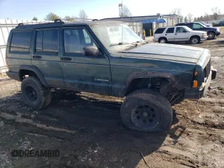 1999 Jeep Cherokee SE with VIN 1J4FF28S3XL551875, listed as a Copart auction lot 43057555 with 226,794 mi miles and Salvage title. Bid and sale history available at DreamBid. Image 4.