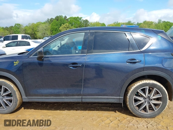 2018 Mazda CX-5 Grand Touring z VIN JM3KFADM8J1406007, wystawiony jako IAAI lot #42008567 z przebiegiem 110 661 mil mil oraz . Historia ofert i sprzedaży dostępna na DreamBid. Obrazek 14.