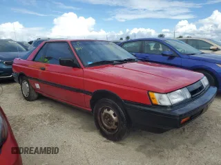 1987 Nissan Sentra z VIN JN1PB2411HU026525, wystawiony jako Copart lot #78997744 z przebiegiem 65 716 mil mil oraz Nie do naprawy. Historia ofert i sprzedaży dostępna na DreamBid. Obrazek 4.