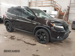 2020 Honda Passport Elite z VIN 5FNYF8H02LB010085, wystawiony jako IAAI lot #41815080 z przebiegiem 79 343 mil mil oraz . Historia ofert i sprzedaży dostępna na DreamBid. Obrazek 1.