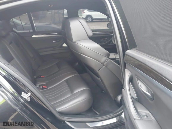 2013 BMW M5 with VIN WBSFV9C51DD095750, listed as a IAAI auction lot 40907304 with 93,014 mi miles. Bid and sale history available at carsss.com. Image 8.