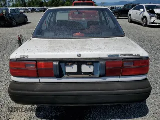 1991 Toyota Corolla z VIN JT2AE94A6M3427211, wystawiony jako Copart lot #60075885 z przebiegiem 179 936 mil mil oraz Czysty tytuł • Clean title. Historia ofert i sprzedaży dostępna na DreamBid. Obrazek 6.