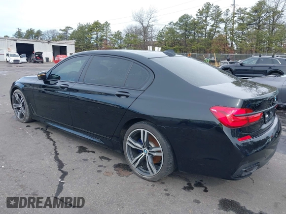 2019 BMW 7 Series 740i with VIN WBA7E2C57KB217973, listed as a IAAI auction lot 39064321 with 54,818 mi miles and . Bid and sale history available at DreamBid. Image 3.