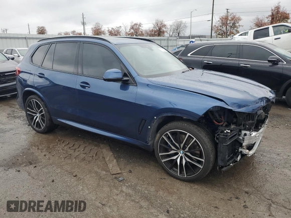2020 BMW X5 M50i with VIN 5UXJU4C07LLE46002, listed as a Copart auction lot 77853984 with 74,098 mi miles and Salvage Title. Bid and sale history available at DreamBid. Image 4.