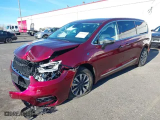 2023 Chrysler Pacifica Hybrid Limited with VIN 2C4RC1S7XPR518695, listed as a IAAI auction lot 41301401 with 24,433 mi miles. Bid and sale history available at carsss.com. Image 2.