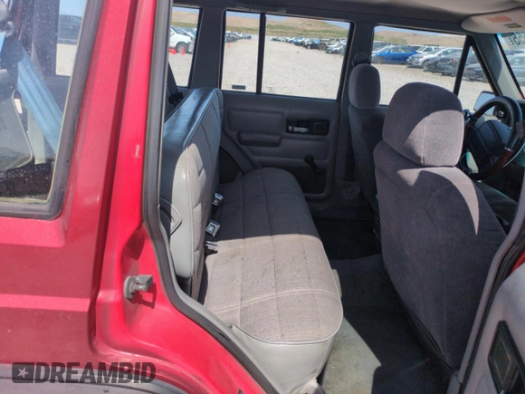 1996 Jeep Cherokee Sport with VIN 1J4FJ68S6TL171056, listed as a Copart auction lot 52099555 with 250,089 mi miles and Salvage Title. Bid and sale history available at carsss.com. Image 10.