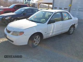 2001 Mazda Protege LX with VIN JM1BJ225710406286, listed as a IAAI auction lot 41887127 with Not Provided miles and . Bid and sale history available at DreamBid. Image 2.
