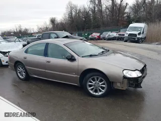 2000 Chrysler LHS with VIN 2C3HC56G9YH180828, listed as a IAAI auction lot 41504718 with 153,670 mi miles. Bid and sale history available at carsss.com. Image 14.