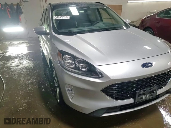 2020 Ford Escape Titanium Hybrid z VIN 1FMCU9DZ6LUB39475, wystawiony jako Copart lot #50159215 z przebiegiem 76 496 mil mil oraz Szkoda całkowita • Salvage title. Historia ofert i sprzedaży dostępna na DreamBid. Obrazek 13.