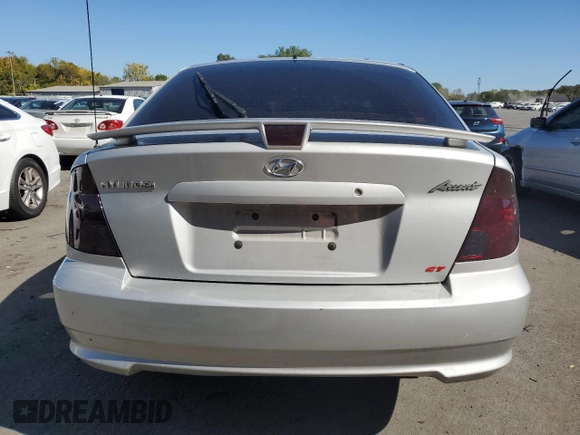 2005 Hyundai Accent GLS with VIN KMHCG35C05U331928, listed as a Copart auction lot 74672614 with 41,542 mi miles and Salvage Title. Bid and sale history available at carsss.com. Image 6.