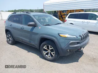 2015 Jeep Cherokee Trailhawk z VIN 1C4PJMBS2FW500538, wystawiony jako IAAI lot #42000591 z przebiegiem 163 035 mil mil oraz . Historia ofert i sprzedaży dostępna na DreamBid. Obrazek 1.