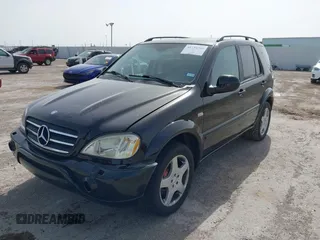 2001 Mercedes-Benz M-Class AMG with VIN 4JGAB74E51A272841, listed as a IAAI auction lot 41734340 with 168,387 mi miles. Bid and sale history available at carsss.com. Image 2.