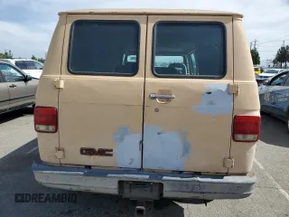 1992 GMC Vandura z VIN 2GTGG39K7N4508329, wystawiony jako Copart lot #56752215 z przebiegiem 248 713 mil mil oraz Tytuł czysty. Historia ofert i sprzedaży dostępna na DreamBid. Obrazek 6.
