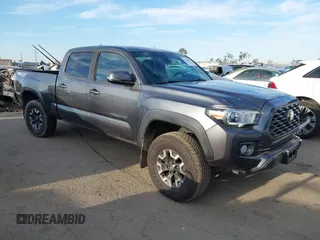 2021 Toyota Tacoma SR5 z VIN 3TMDZ5BN6MM110938, wystawiony jako IAAI lot #41838703 z przebiegiem 67 680 mil mil oraz . Historia ofert i sprzedaży dostępna na DreamBid. Obrazek 1.