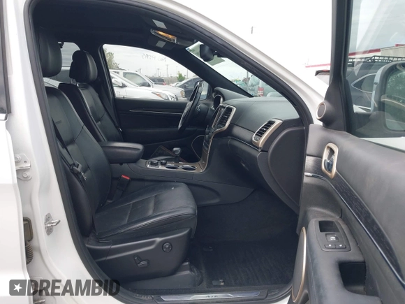 2014 Jeep Grand Cherokee Summit z VIN 1C4RJFJG2EC476114, wystawiony jako IAAI lot #42249108 z przebiegiem 97 569 mil mil oraz . Historia ofert i sprzedaży dostępna na DreamBid. Obrazek 5.