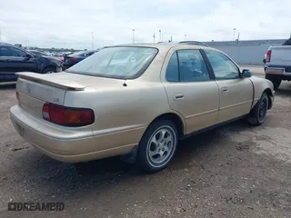 1996 Toyota Camry DX with VIN 4T1BG12K7TU781388, listed as a IAAI auction lot 42089118 with 196,988 mi miles. Bid and sale history available at carsss.com. Image 4.