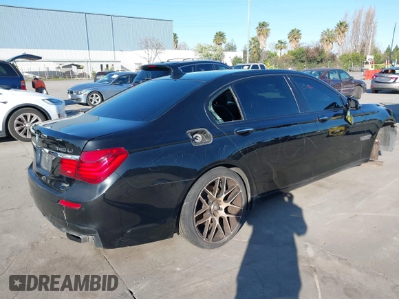 2014 BMW 7 Series 740Li with VIN WBAYE4C56ED137847, listed as a IAAI auction lot 39452255 with 184,471 mi miles. Bid and sale history available at carsss.com. Image 4.