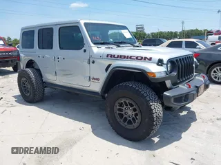 2023 Jeep Wrangler Rubicon with VIN 1C4JJXFG0PW522651, listed as a IAAI auction lot 42112210 with 7,744 mi miles and . Bid and sale history available at carsss.com. Image 1.