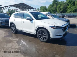 2018 Mazda CX-5 Grand Touring z VIN JM3KFBDM8J0420422, wystawiony jako IAAI lot #42188348 z przebiegiem 102 216 mil mil oraz . Historia ofert i sprzedaży dostępna na DreamBid. Obrazek 1.