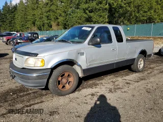 1999 Ford F-150 with VIN 1FTRX17W3XKB49021, listed as a Copart auction lot 48263755 with 157,248 mi miles and Clean Title. Bid and sale history available at DreamBid. Image 1.